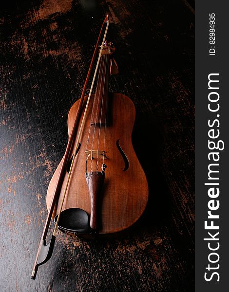 Brown Wooden Violin and Violin Bow