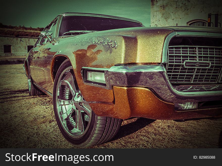 A close up of a 1968 Ford Thunderbird with focus on the front grill.