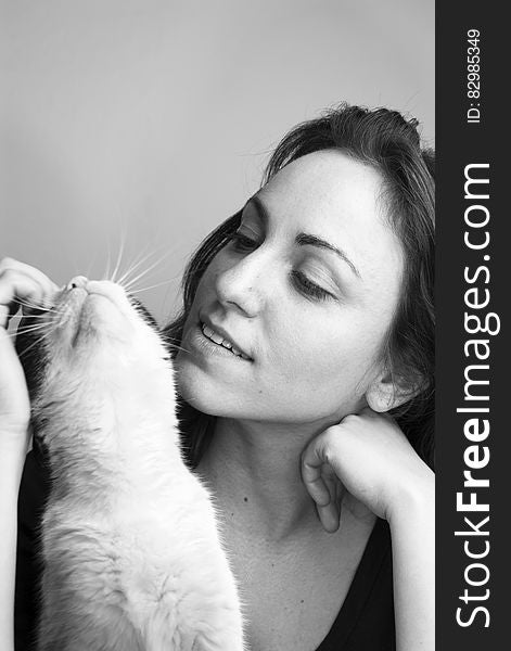 Grayscale Photo of Woman and Cat
