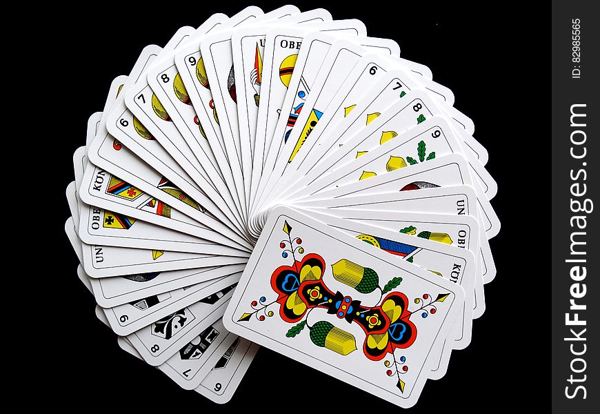 White and Yellow Playing Cards