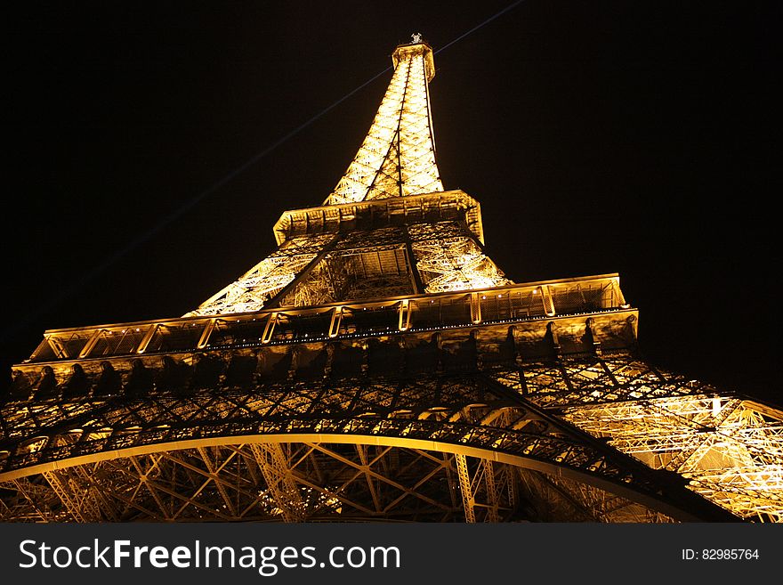 Eiffel Tower illuminated against night skies in Paris, France. Eiffel Tower illuminated against night skies in Paris, France.