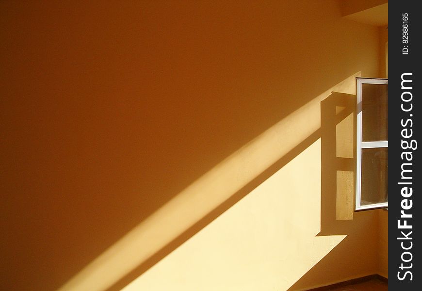 Sunlit Window On Wall