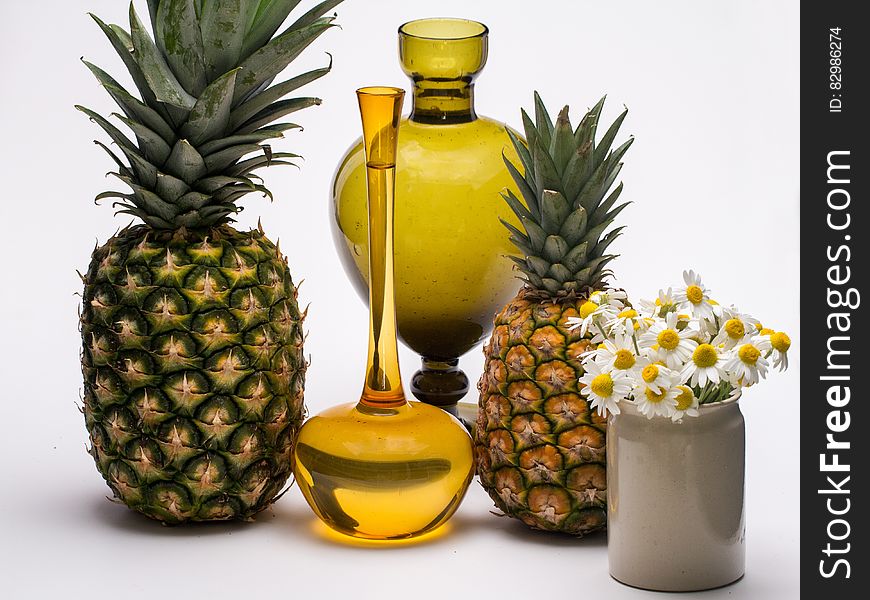 Pineapples, Flowers And Vases