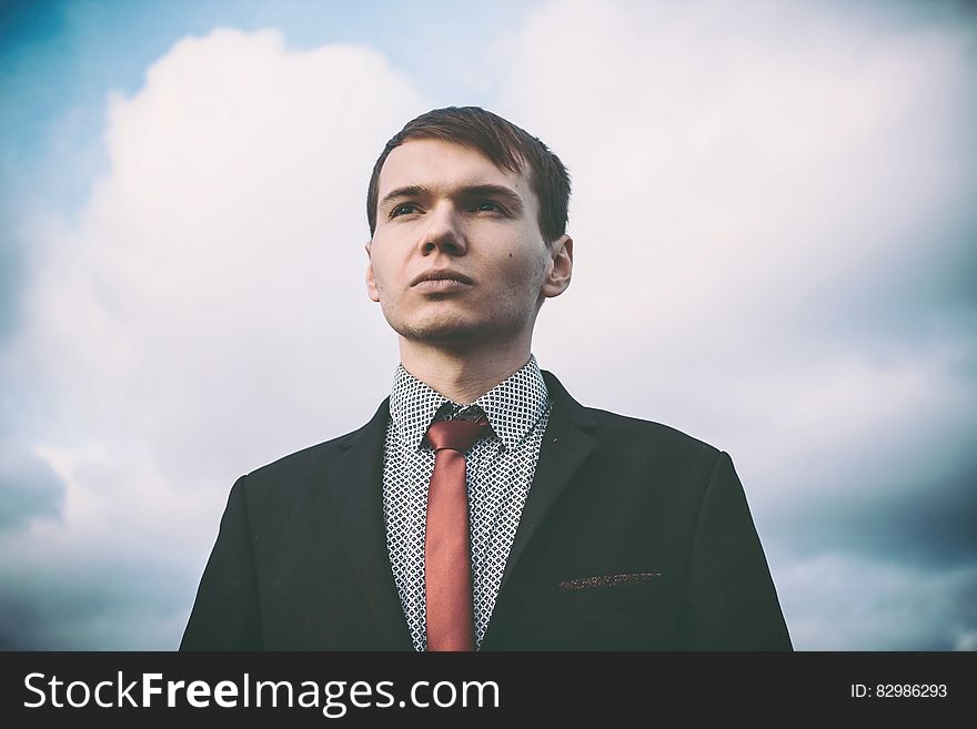 Portrait Of Young Man Against Sky