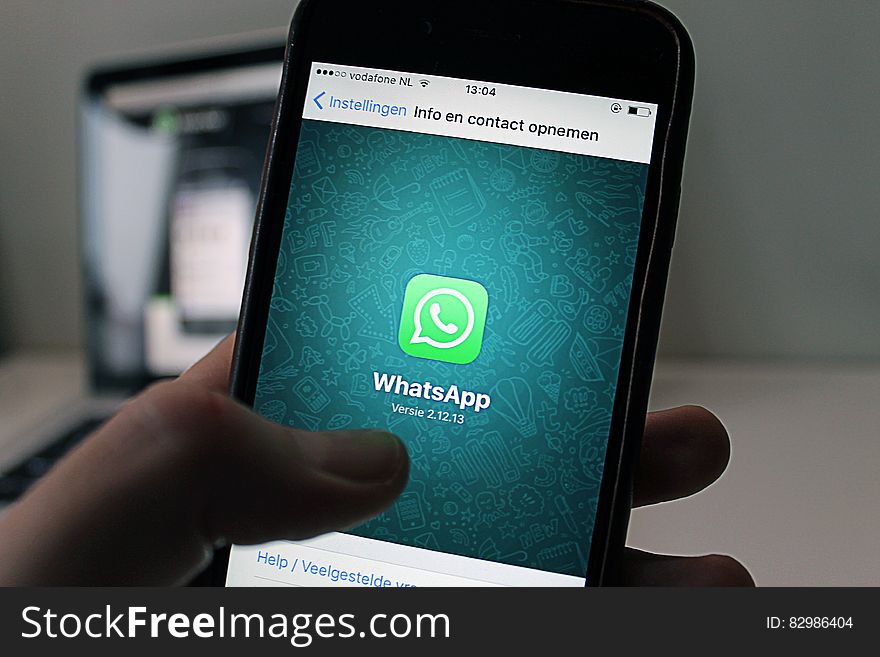 Apple iPhone screen running WhatsApp application.