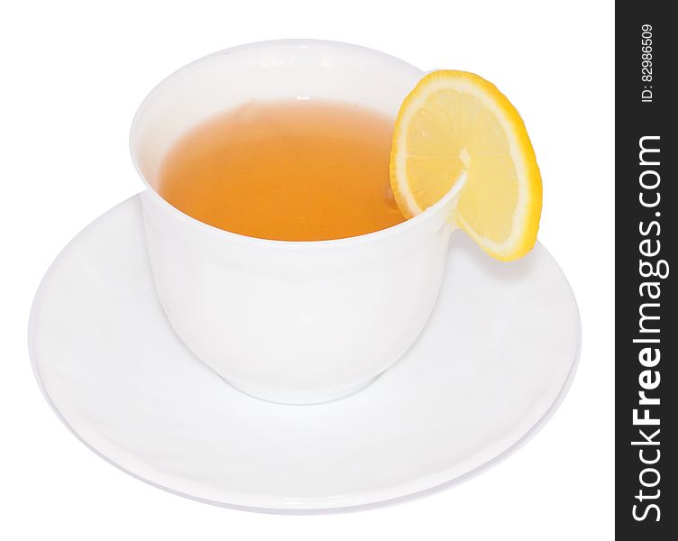 Sliced Lemon On White Ceramic Cup With Tea