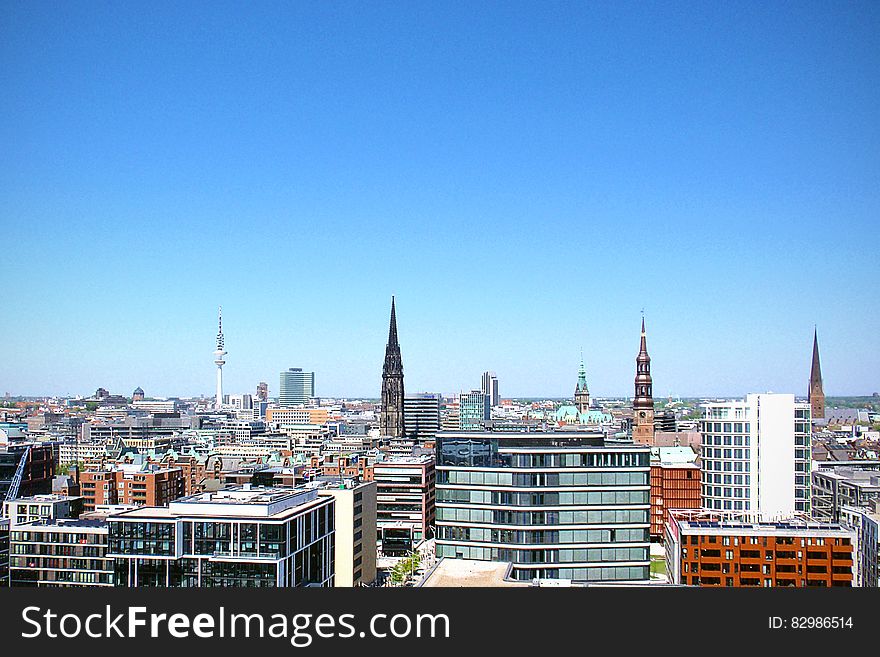 Roof tops of Hamburg, Germany in aerial skyline against blue skies. Roof tops of Hamburg, Germany in aerial skyline against blue skies.