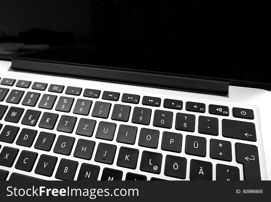 Background created by a closeup of a laptop computer showing keyboard and blank screen. Background created by a closeup of a laptop computer showing keyboard and blank screen.