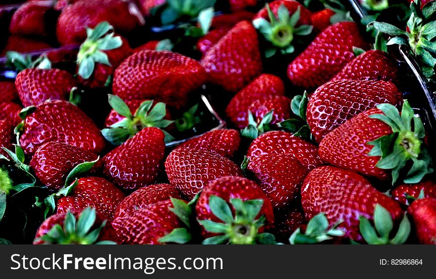 Closeup of fresh ripe strawberries in punnet.