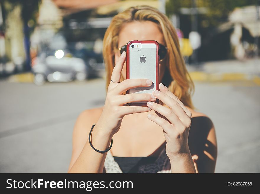 Woman Using IPhone Camera