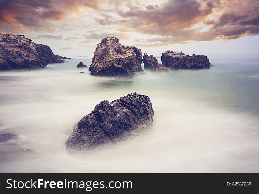 Rocks and mists by the ocean