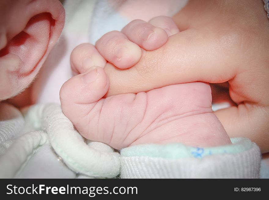 Baby Holding Human Index Finger