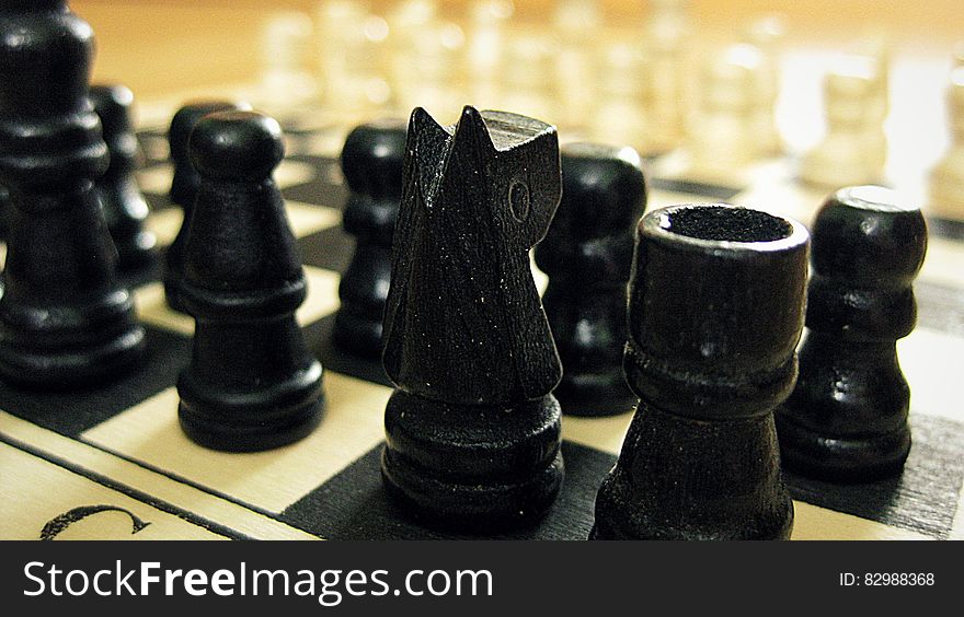 Black Chess Pieces on Chess Board