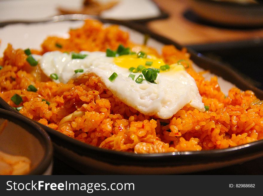 White And Yellow Sunny Side Up Egg On Fried Rice