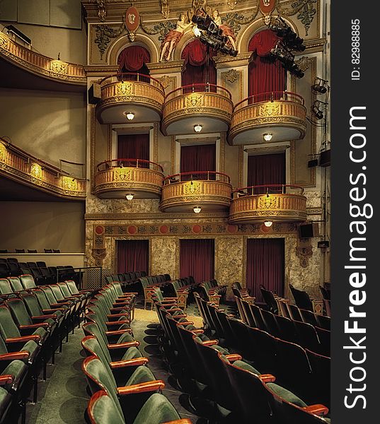 Elegant balconies and empty seats inside a theater. Elegant balconies and empty seats inside a theater.