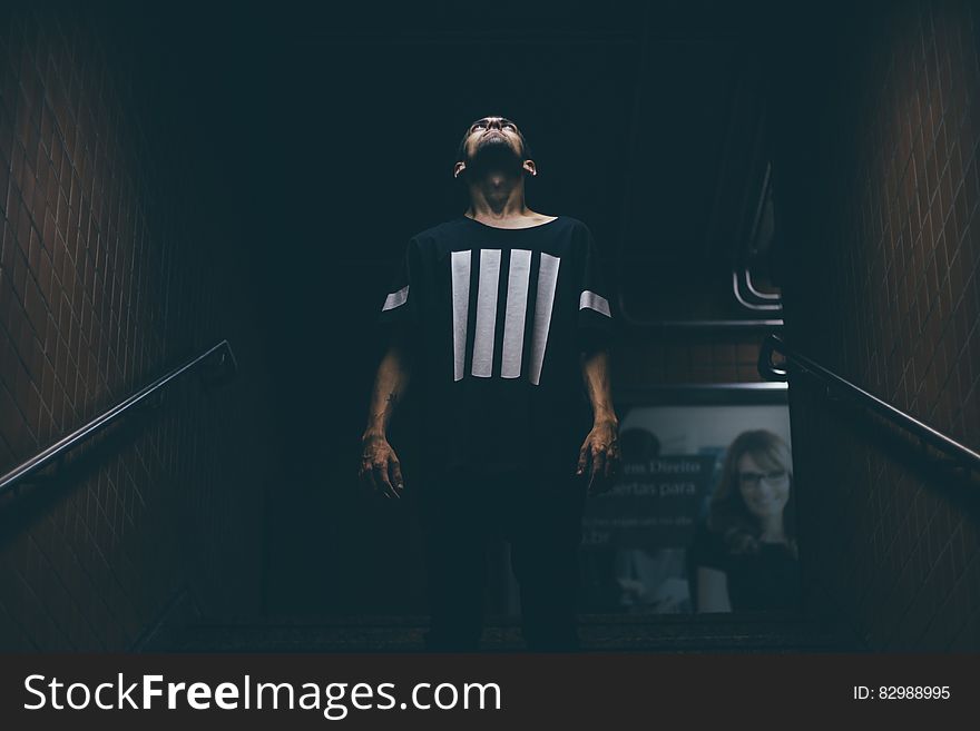 Man Standing on Stair Case Looking Up