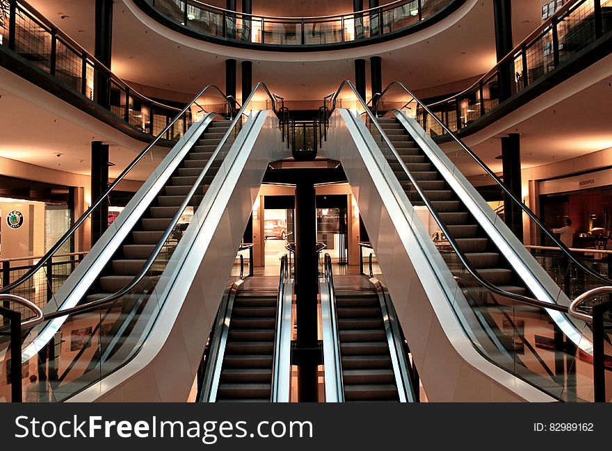 Atrium and escalators in a shopping center or mall. Atrium and escalators in a shopping center or mall.