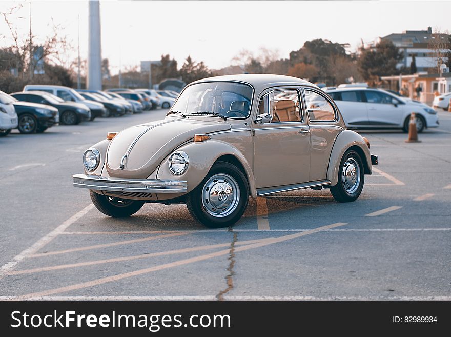 Brown Volkswagen Beetle at Parking Lot