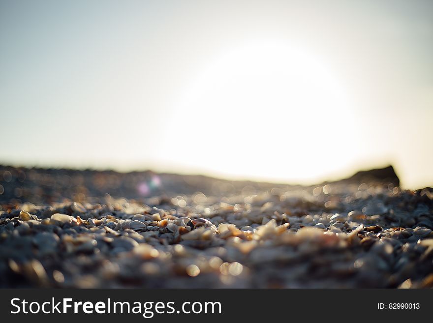 Gray Rocky Field Under Clear Sky During Daytime