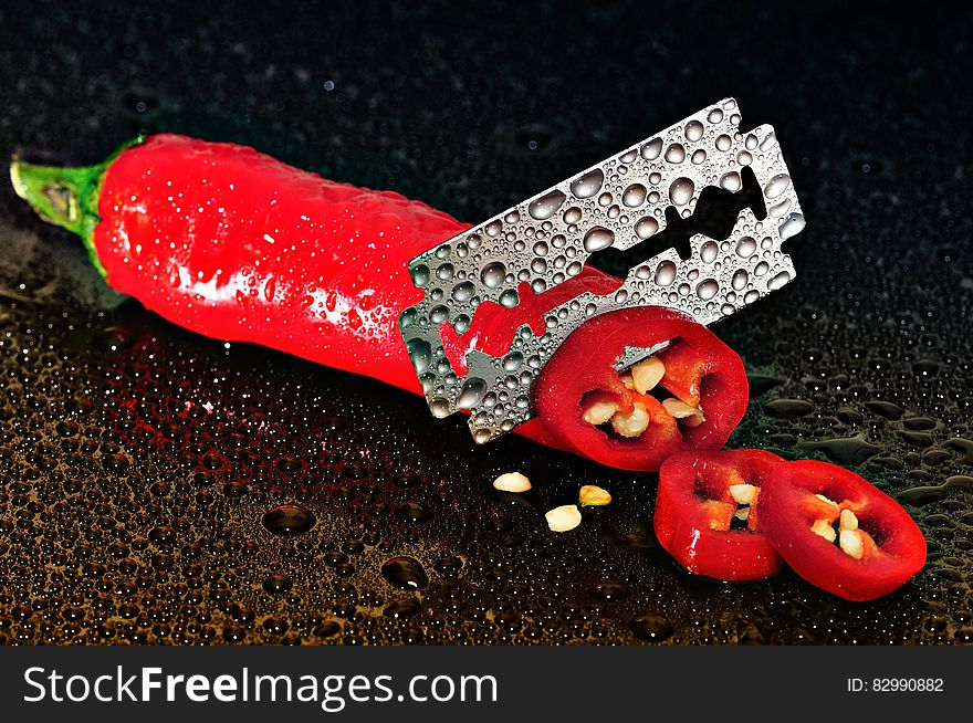 Red Chili Pepper Sliced by a Blade