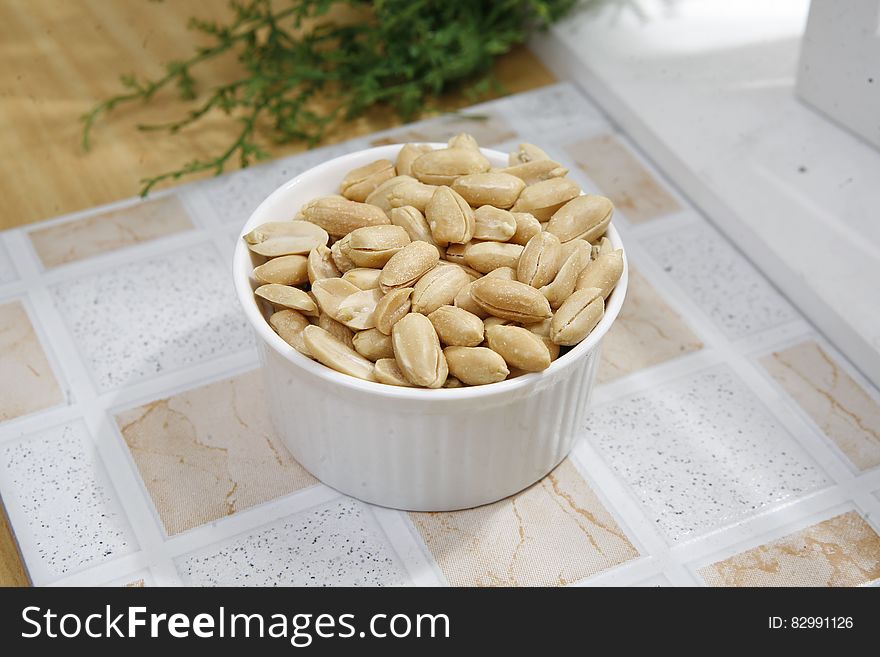Peanuts in White Ceramic Bowl