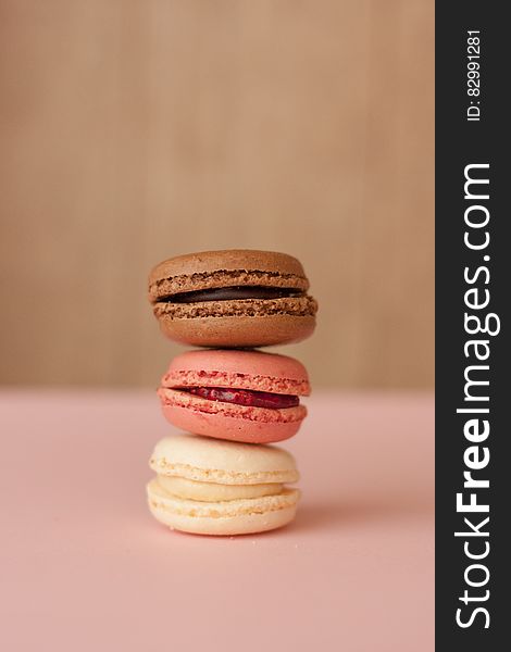 Stack of colorful filled French macaroons.