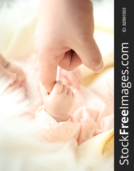 Baby Holding Person&#x27;s Index Finger