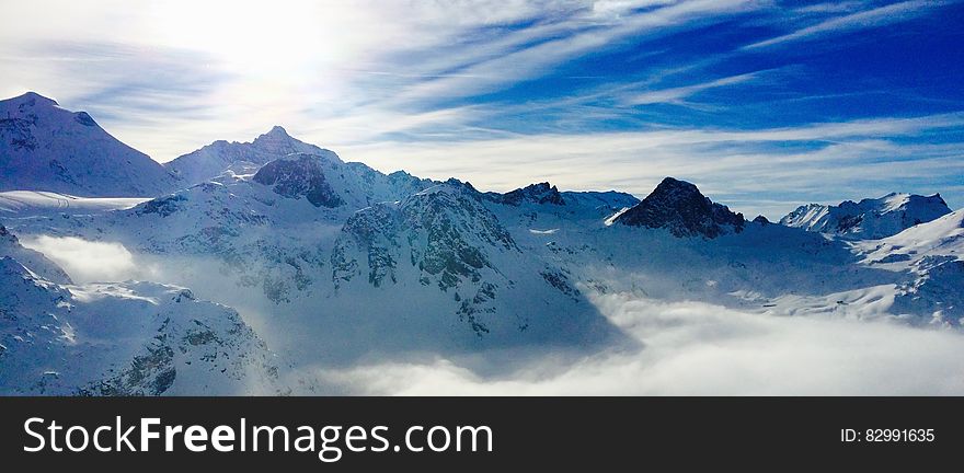 White Snow Covered Mountain Under Blue Sky