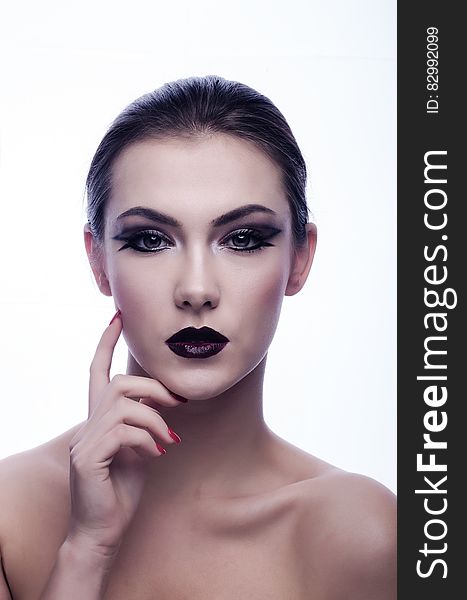 Naked Woman In Black Eyeliner And Maroon Lips