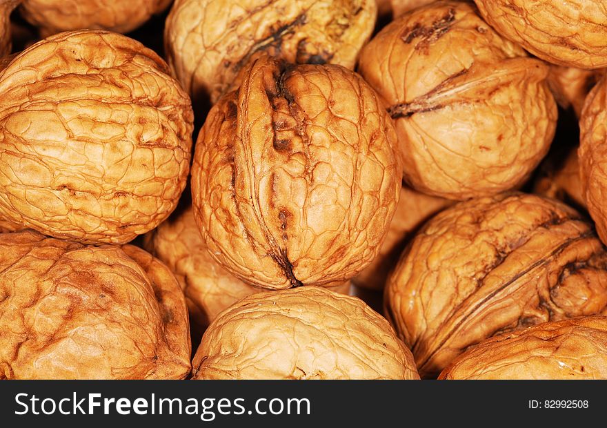 Close up of whole walnuts in the shell. Close up of whole walnuts in the shell.