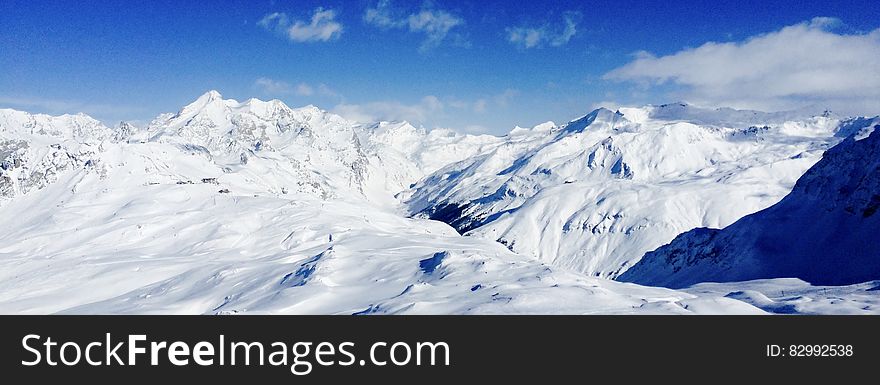 Snow Covered Mountain Under Blue Sky during Daytime