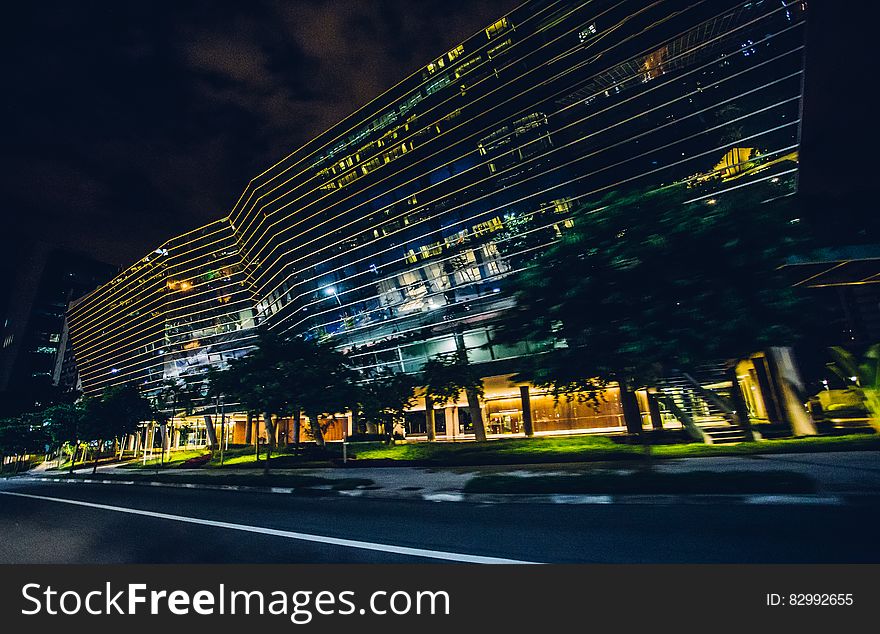 Black And Gray Buildings Lighted During Night Time