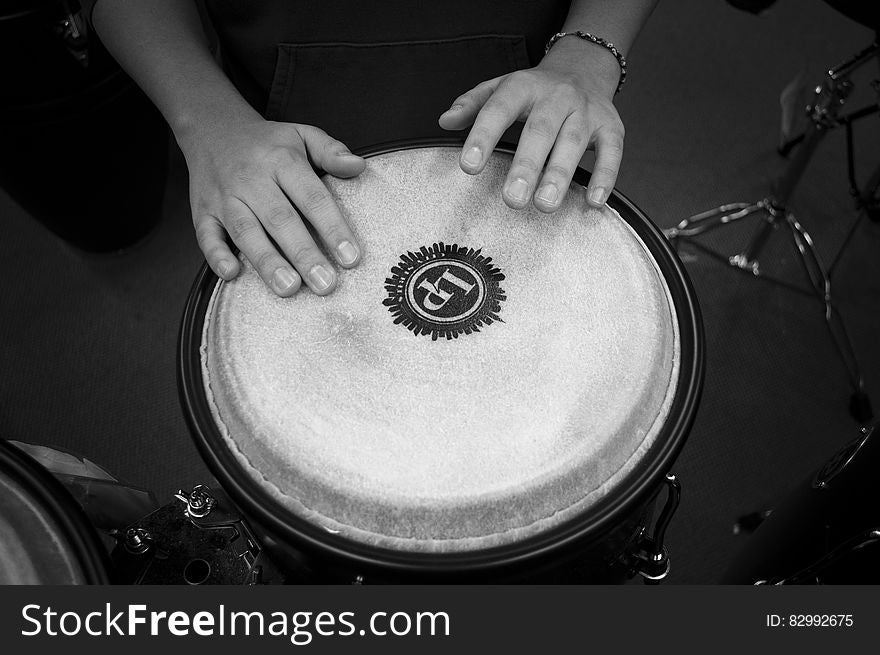 Person Holding Drums