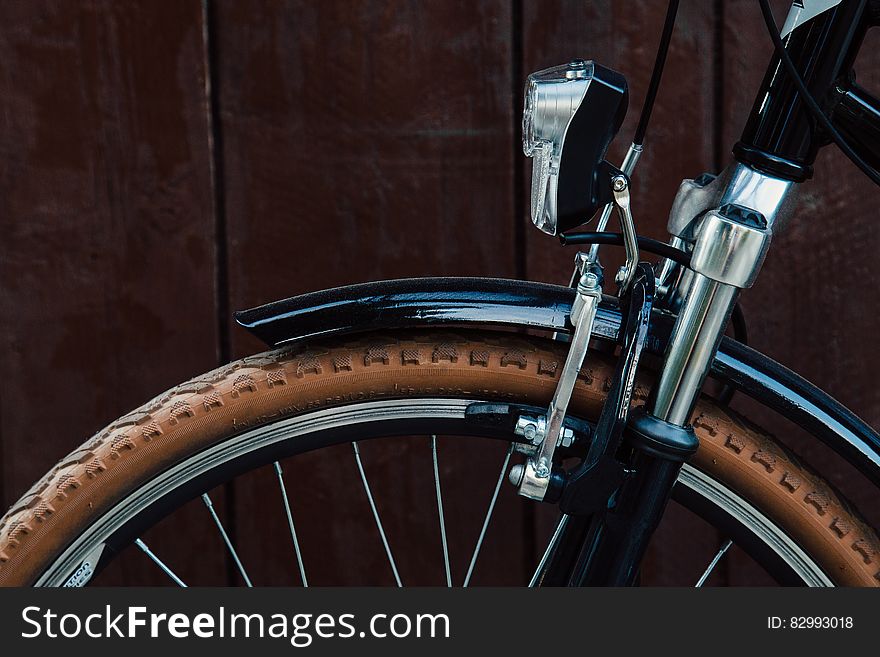 Close up on frame and wheel of bicycle. Close up on frame and wheel of bicycle.