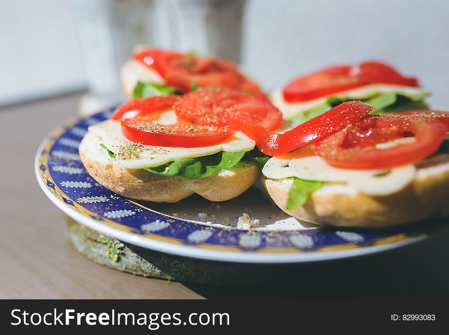 Sandwiches with cheese, lettuce and tomato on a plate