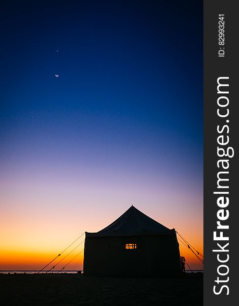 Camping Tent Near Sea Under Blue Sky During Sunset