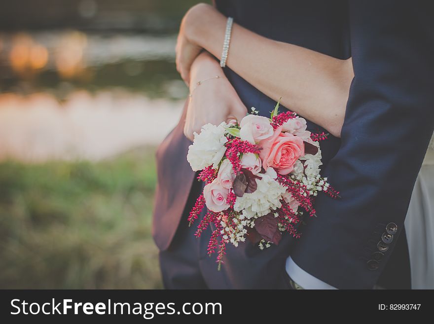 Person Holding A Bouquet Of Flower