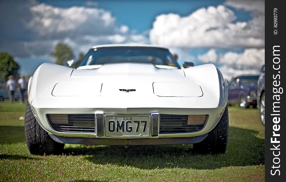 White Corvette C3 With Omg77 License Plate on Display
