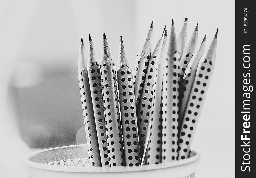 Grayscale Photography of Pencil Inside Round Basket