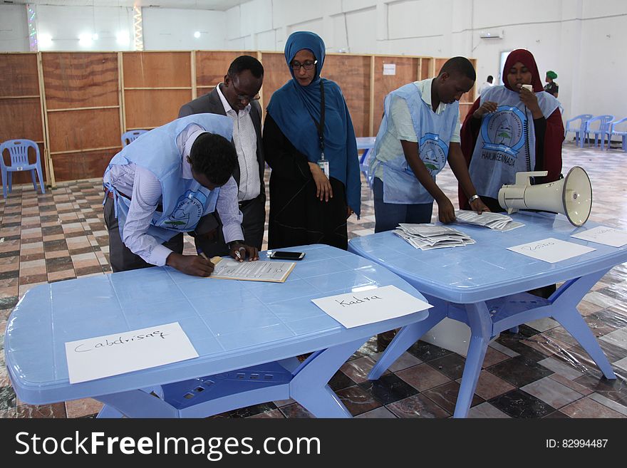 Electoral officials count and tally votes at a polling station during the electoral process for Somaliland and the northern regions held in Mogadishu on Thursday, December 22, 2016. AMISOM Photo/ Atulinda Allan. Electoral officials count and tally votes at a polling station during the electoral process for Somaliland and the northern regions held in Mogadishu on Thursday, December 22, 2016. AMISOM Photo/ Atulinda Allan