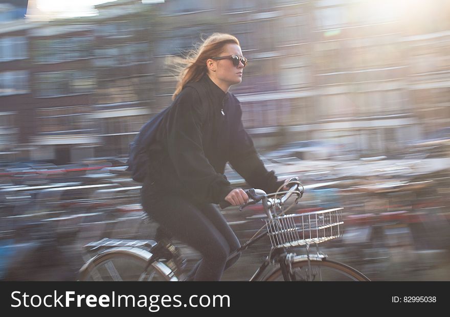 Woman Riding Bicycle