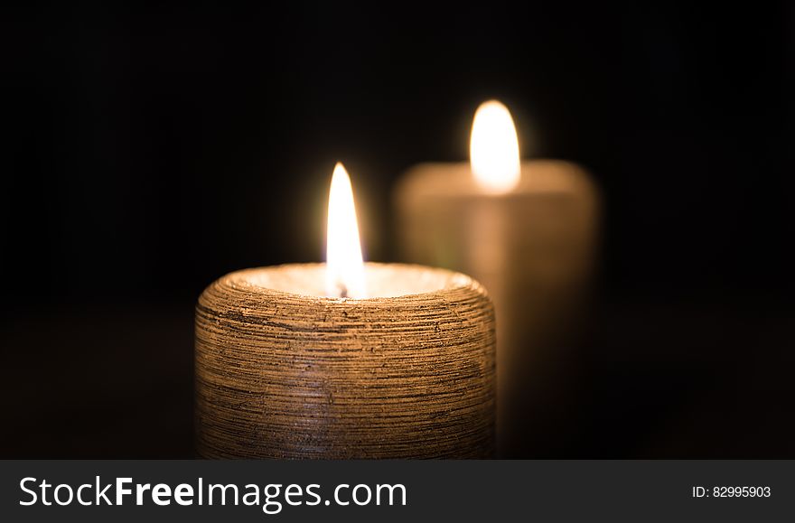 2 Lighted Candle in Lit Room