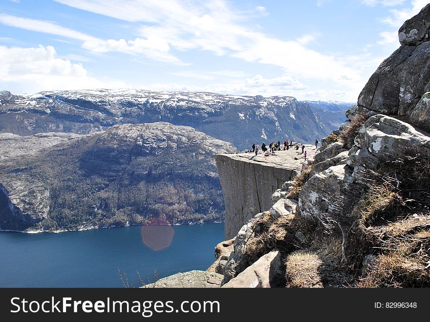 Group of People on Top of Mountain during Daytime