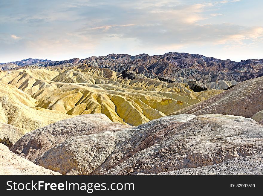 Gray Beige And Brown Rocky Mountain During Daytime