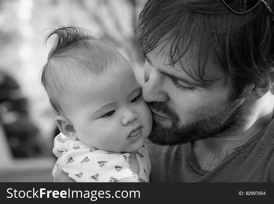 Portrait of father and child outdoors in black and white. Portrait of father and child outdoors in black and white.