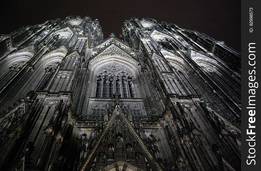 Low Angle Photography of Gray Concrete Cathedral at Nighttime