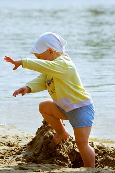 Baby Girl Playing On The Sea Shore Stock Photos Baby Girl Playing On The Sea Shore Stock Photos