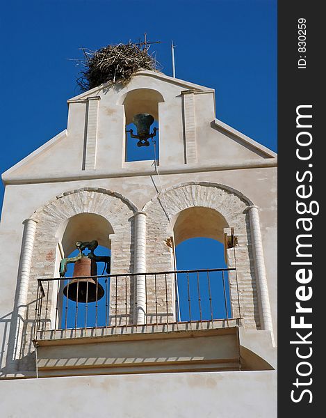 Charming old country church in Spain, with a stork nest on the top. Charming old country church in Spain, with a stork nest on the top.