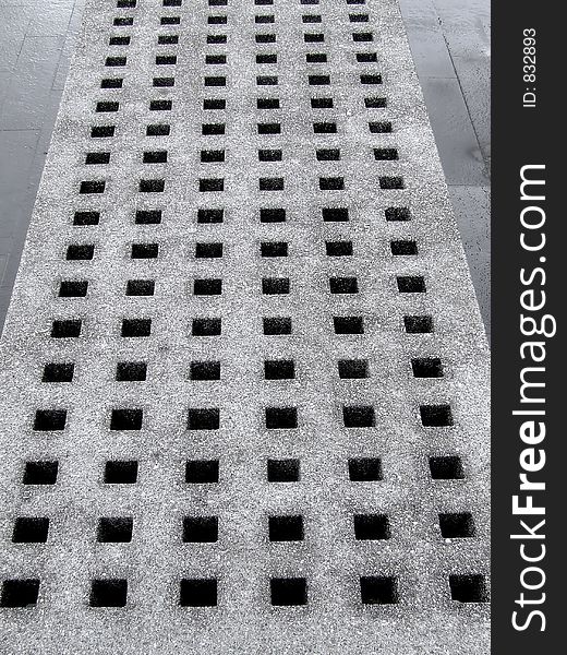 Concrete block with square shaped holes. Concrete block with square shaped holes