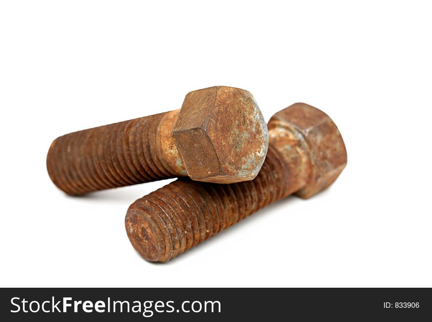 Rusty steel bolts - large old bolts isolated over white, shallow dof. Rusty steel bolts - large old bolts isolated over white, shallow dof